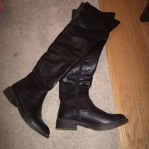 Thigh high leather boots.